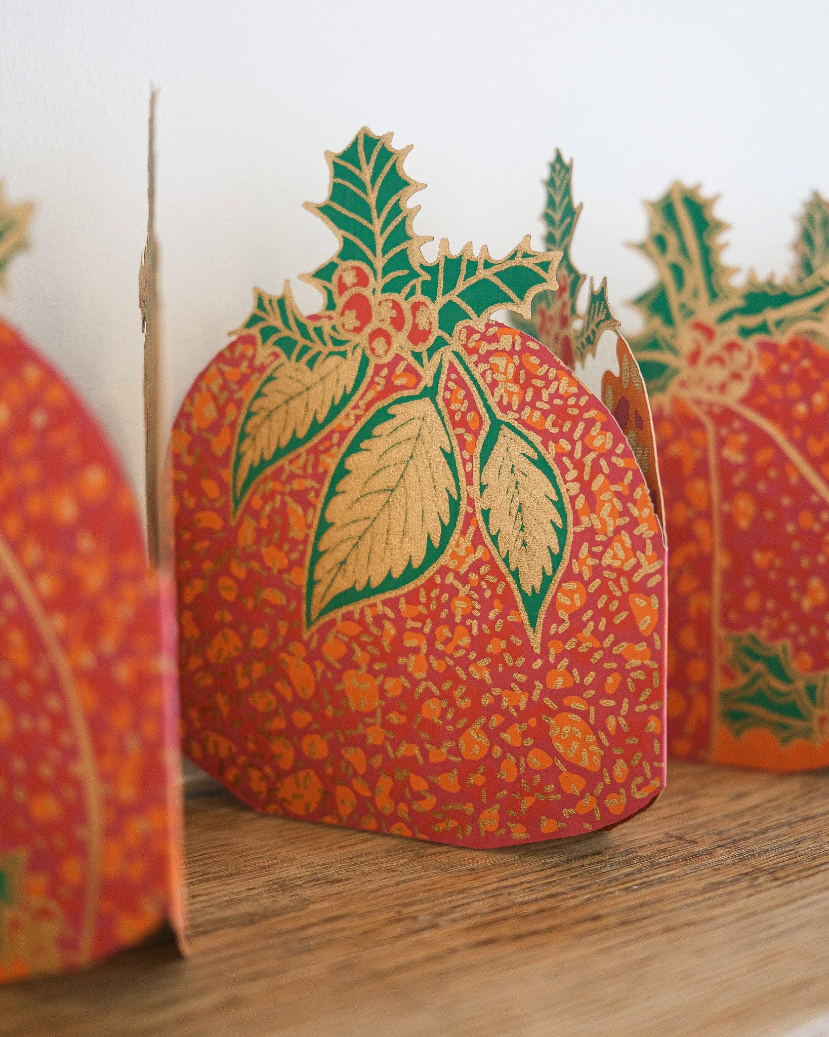 Hand-printed recycled paper Christmas Puddings Concertina Garland by East End Press, 3 metres long