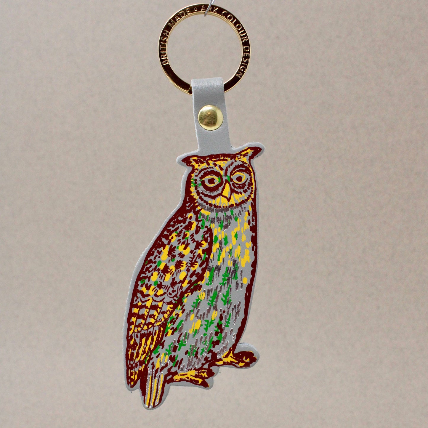 Nocturnal owl leather key fob handmade in Scotland, with gold-plated ring and hot foil embossed design by Ark Colour Design