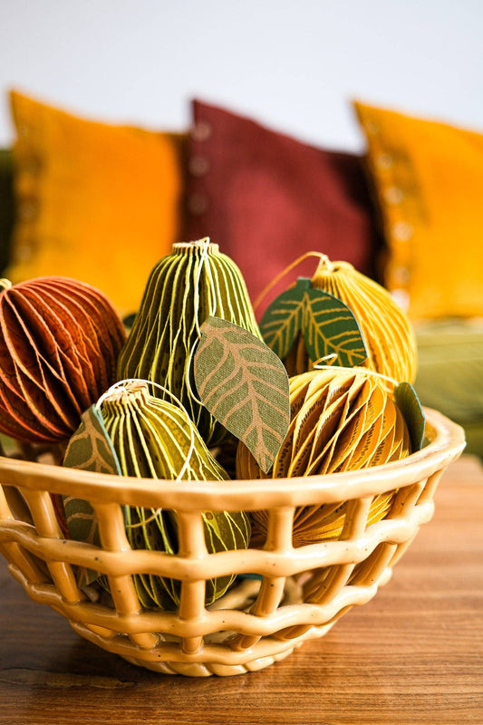 Close-up of intricate recycled cotton paper honeycomb texture on pear ornament
