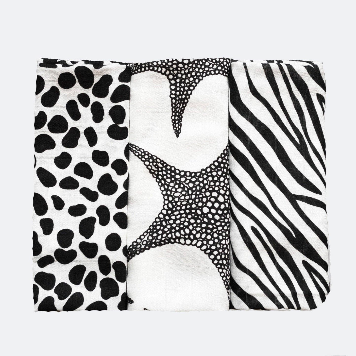 Set of three black and white sensory muslins by Etta Loves featuring zebra, starfish, and dalmatian patterns, made from GOTS-certified organic cotton, 60cm square each.