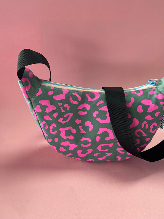 Close-up of Pink Leopard print on Yolla Studio grey waxed canvas sling bag