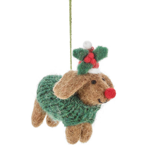 Detail of needle felted sausage dog in hand knitted festive jumper