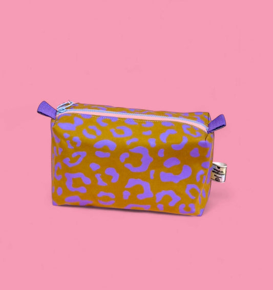 Handprinted boxy pouch with lilac and mustard leopard print on waxed cotton, fully lined cosmetic bag approx 20cm by 15cm.