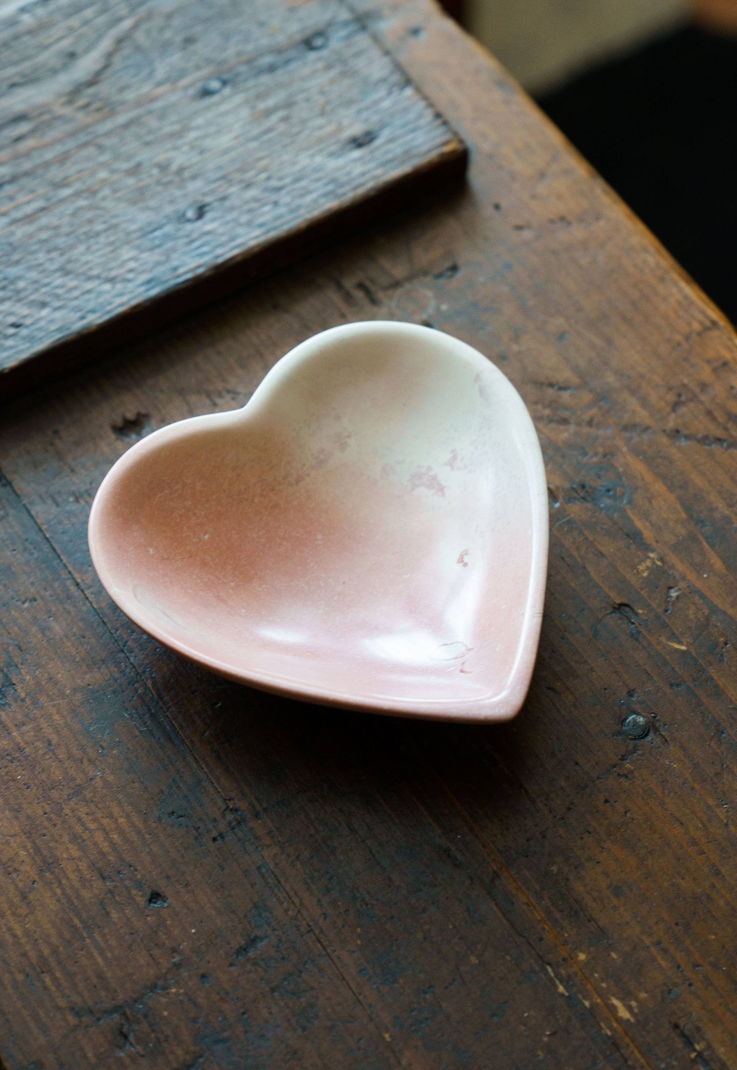 Heart-shaped soapstone jewellery dish, hand carved in Nairobi from sustainable Kenyan stone with natural colour variations.