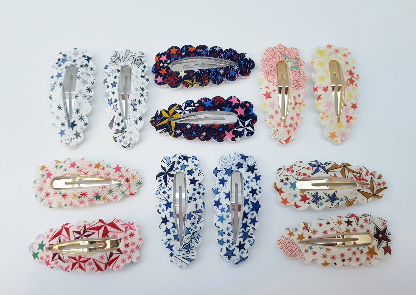 Collection of colourful hair accessories including clips on a white background