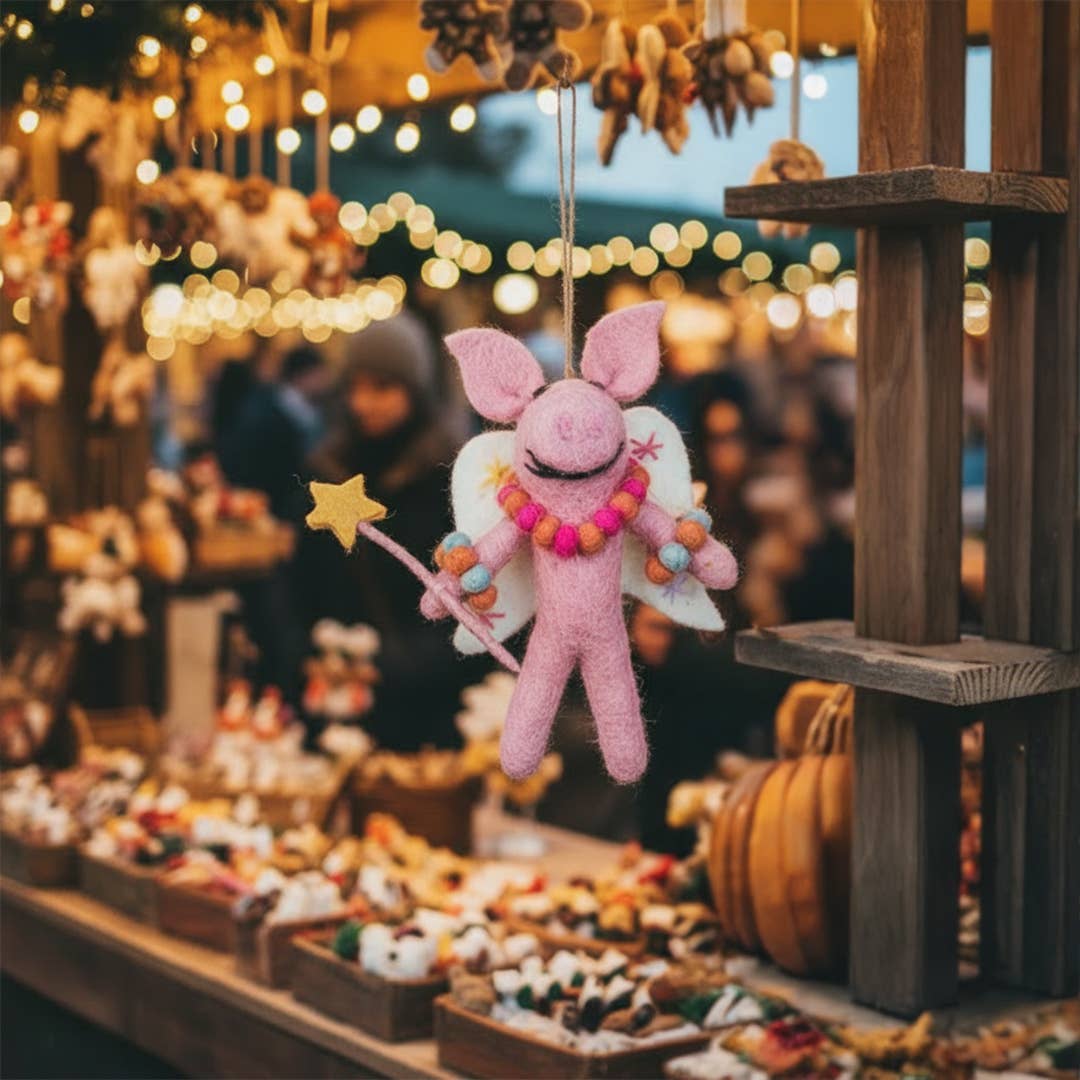 Full view of quirky handmade felt pig fairy hanging festive decoration