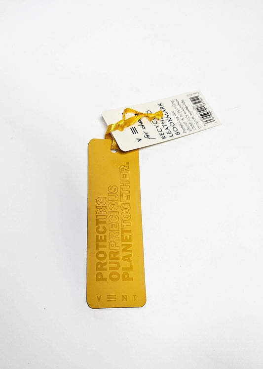 Close-up of debossed recycled leather bookmark in yellow