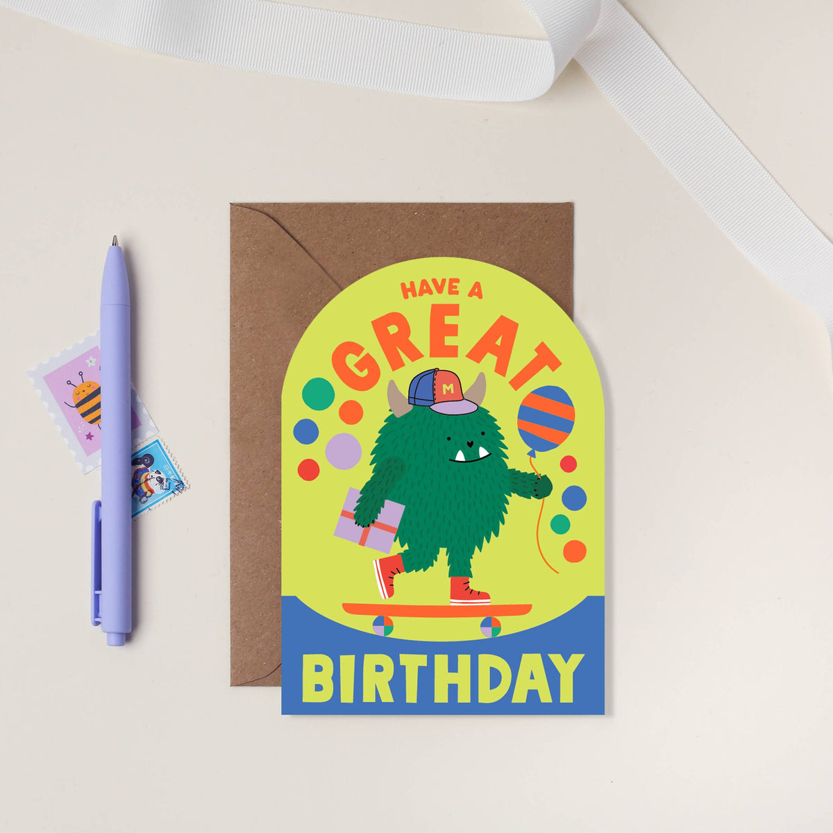 Skateboarding monster kids birthday card with neon ink and arched shape