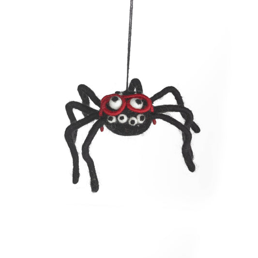 Close-up of Specky the Spider's red glasses on a handmade felt Halloween decoration. Eco-friendly and ethically made.