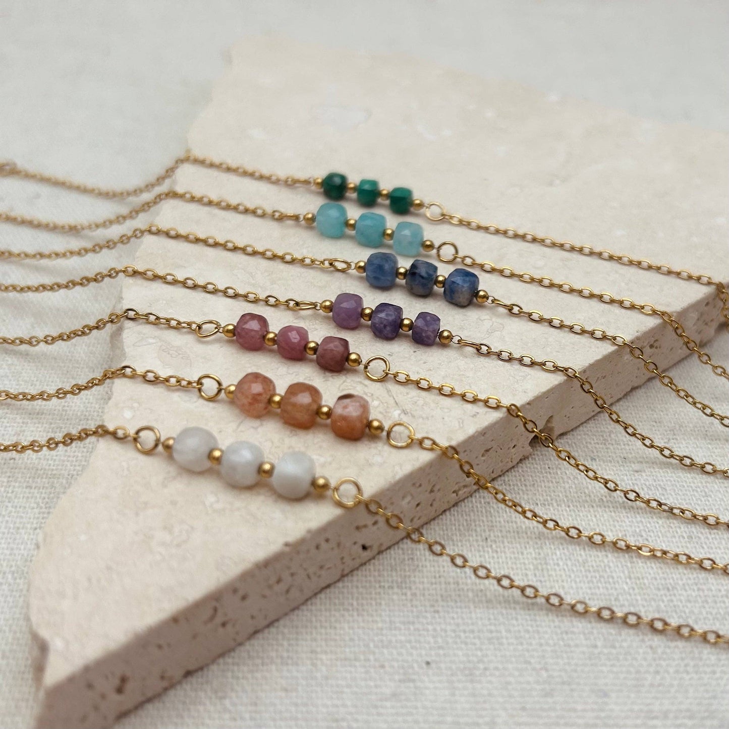 Little Nell lapis trio bead bracelet, gold-plated, waterproof, adjustable chain, and celestial blue lapis lazuli beads