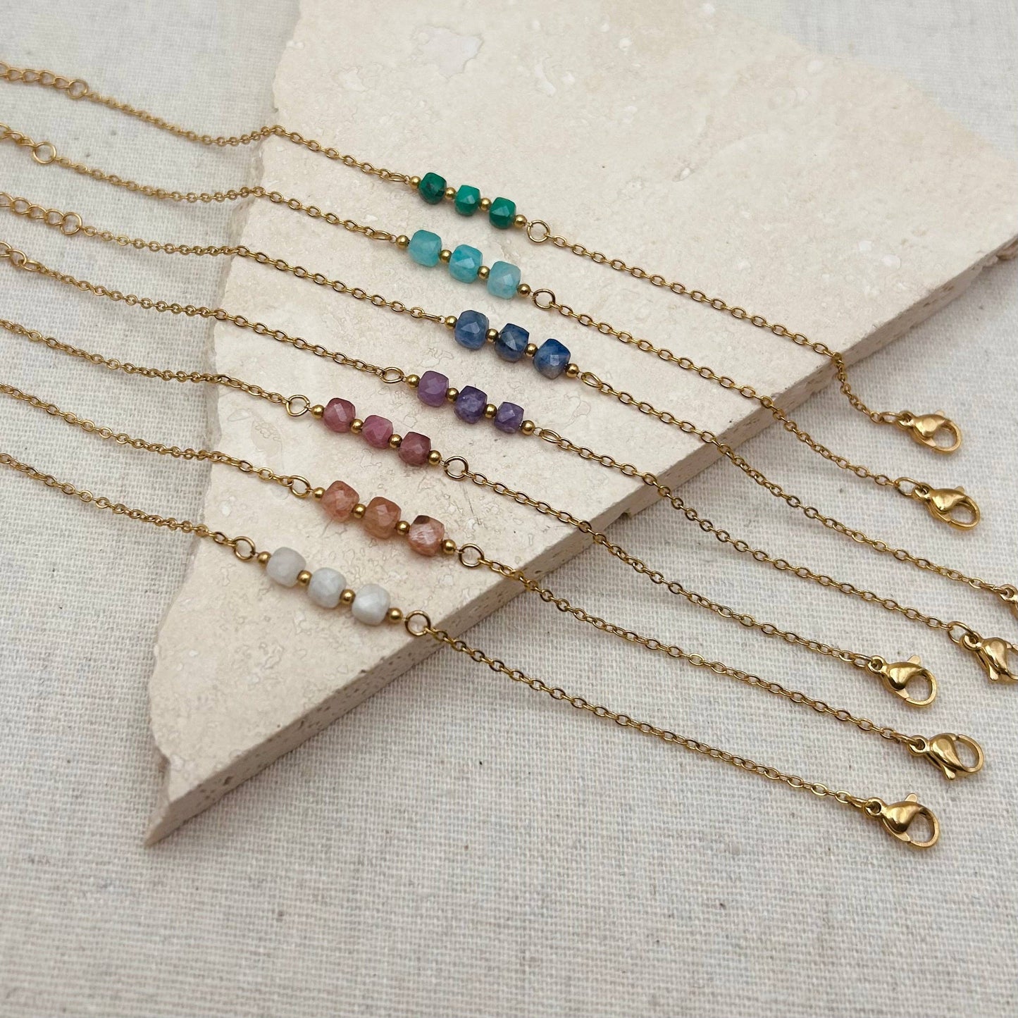 Little Nell lapis trio bead bracelet, gold-plated, waterproof, adjustable chain, and celestial blue lapis lazuli beads