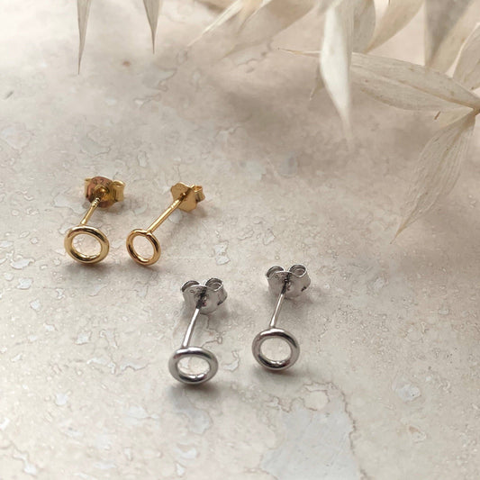 Close-up of Little Nell Gold Vermeil Micro Circle Stud Earring