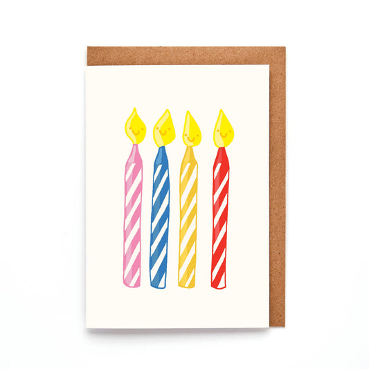 Close up of colourful mini birthday candles greeting card with kraft envelope