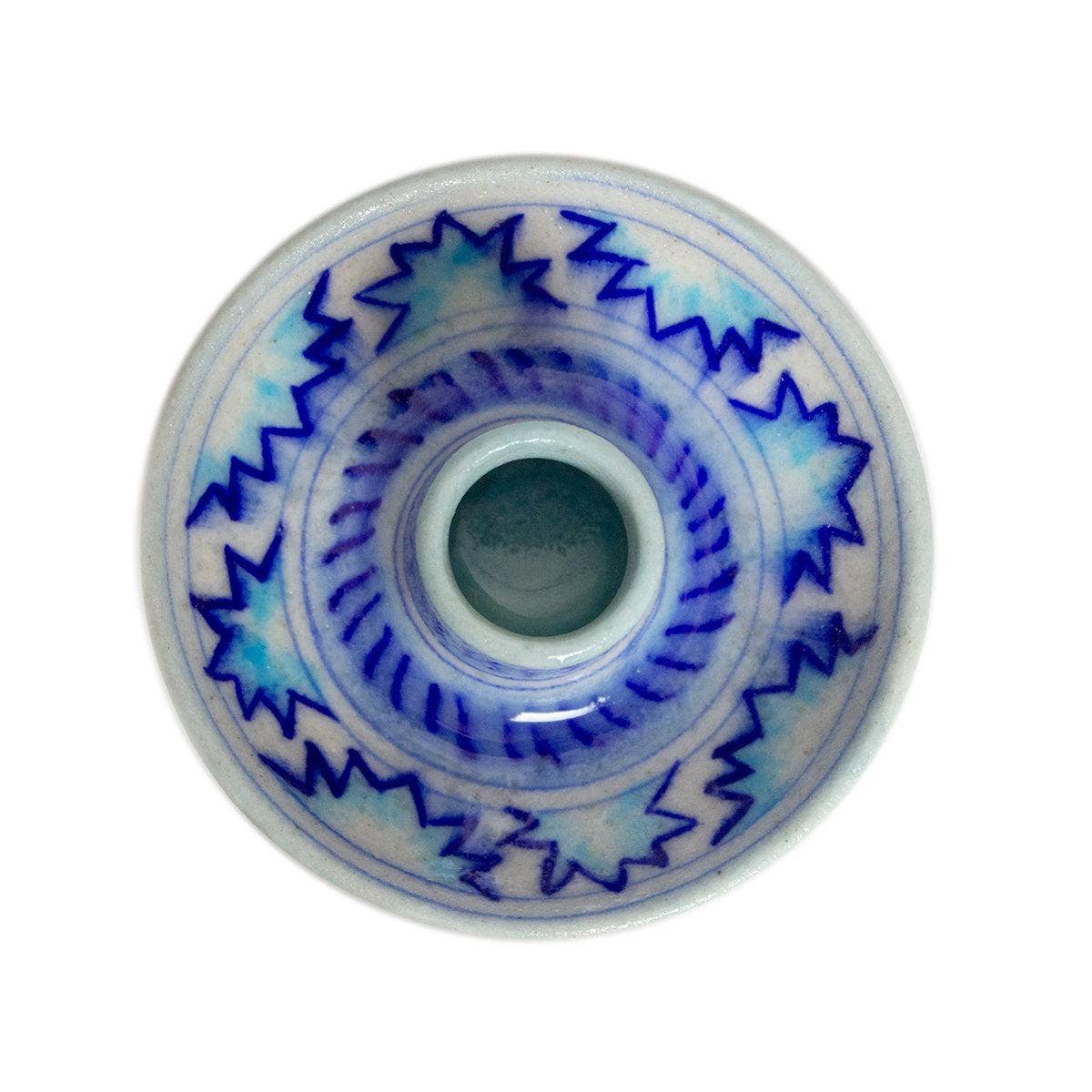 Discover our eco-friendly ceramic candle stick holder, a stunning addition to your sustainable gift collection. Handmade in India, this unique piece showcases a joyful white base adorned with a pale and royal blue pattern, perfect for elevating any dining table or living room decor. By choosing this environmentally responsible present, you support artisans and promote green gifting practices. Brighten your space while making a positive impact—opt for our sustainable gift cards and gifts today!