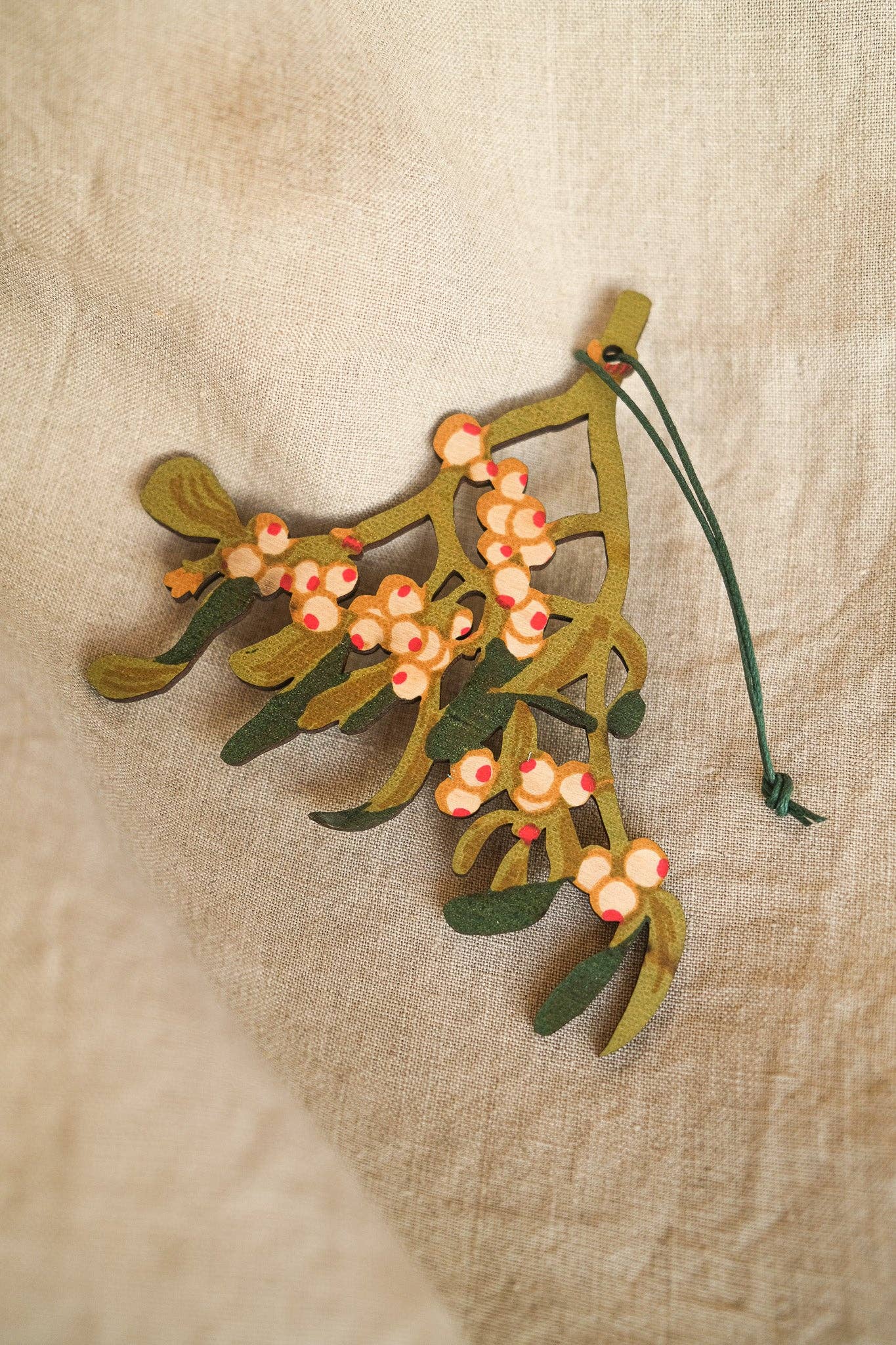 Hand screen printed Mistletoe Wooden Ornament by East End Press, sustainably certified plywood, double-sided festive decoration