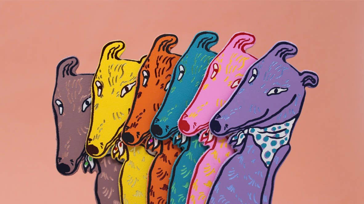Dog Tails genuine leather double-sided bookmark embossed with dog design and ‘Tell tails’, British made by Ark Colour Design.