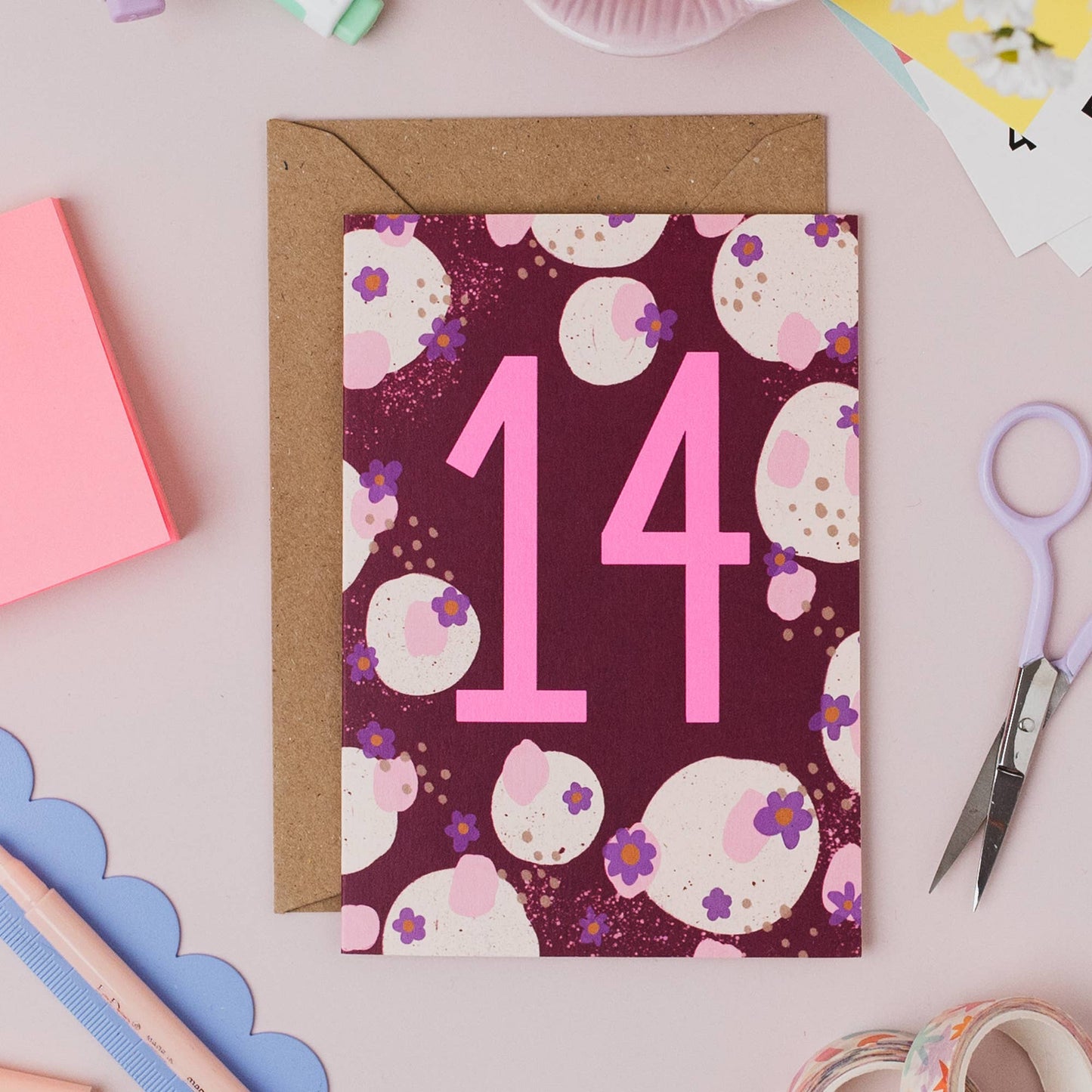 Back of Teen Neon 14th Birthday Card, showing UK made and plastic-free details, with kraft envelope.