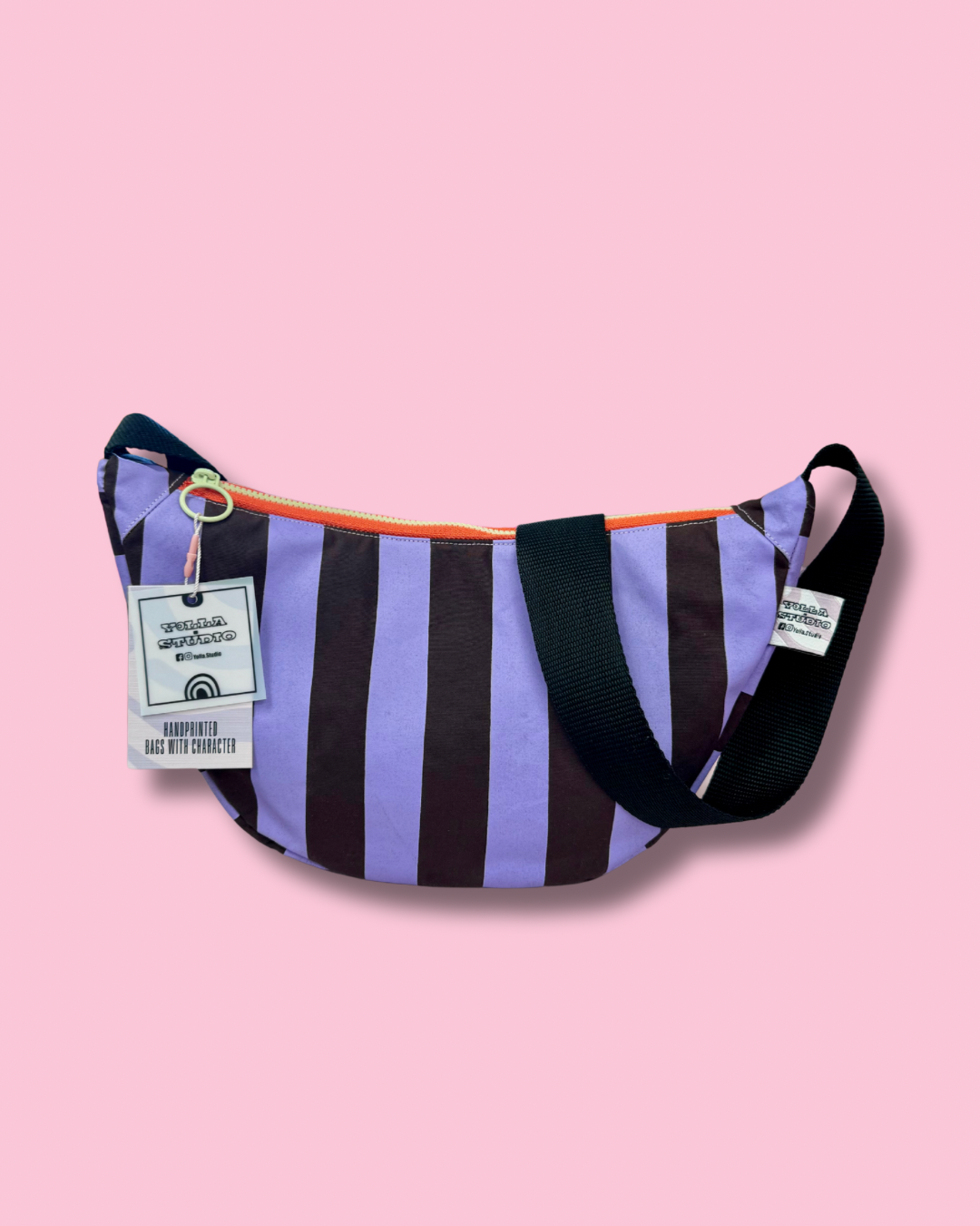 Handprinted purple and burgundy stripes on durable canvas bag