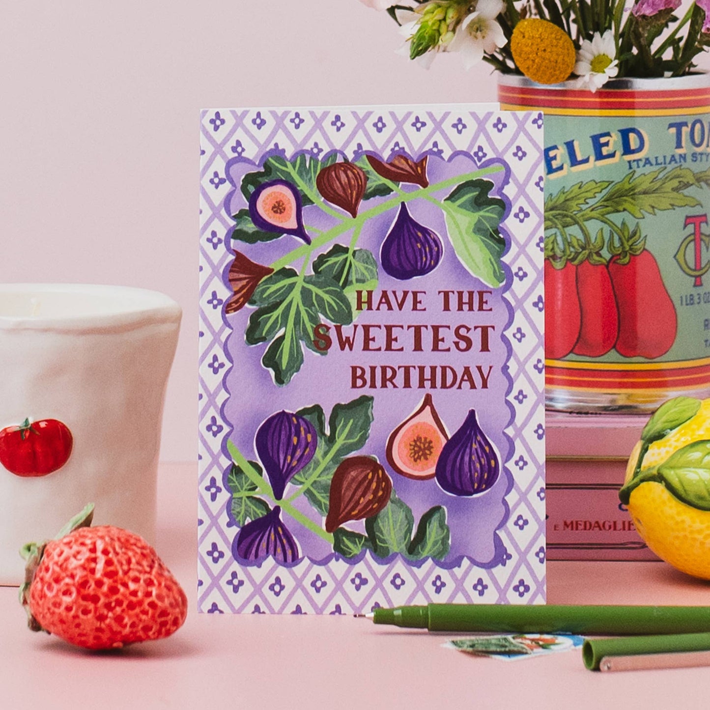Hand drawn lettering reads 'Have the sweetest birthday'. Part of the on trend Palermo Picnic range, inspired by Italian fruits. Illustrated greeting card with tile pattern and figs illustration, printed onto premium textured card with a kraft envelope.