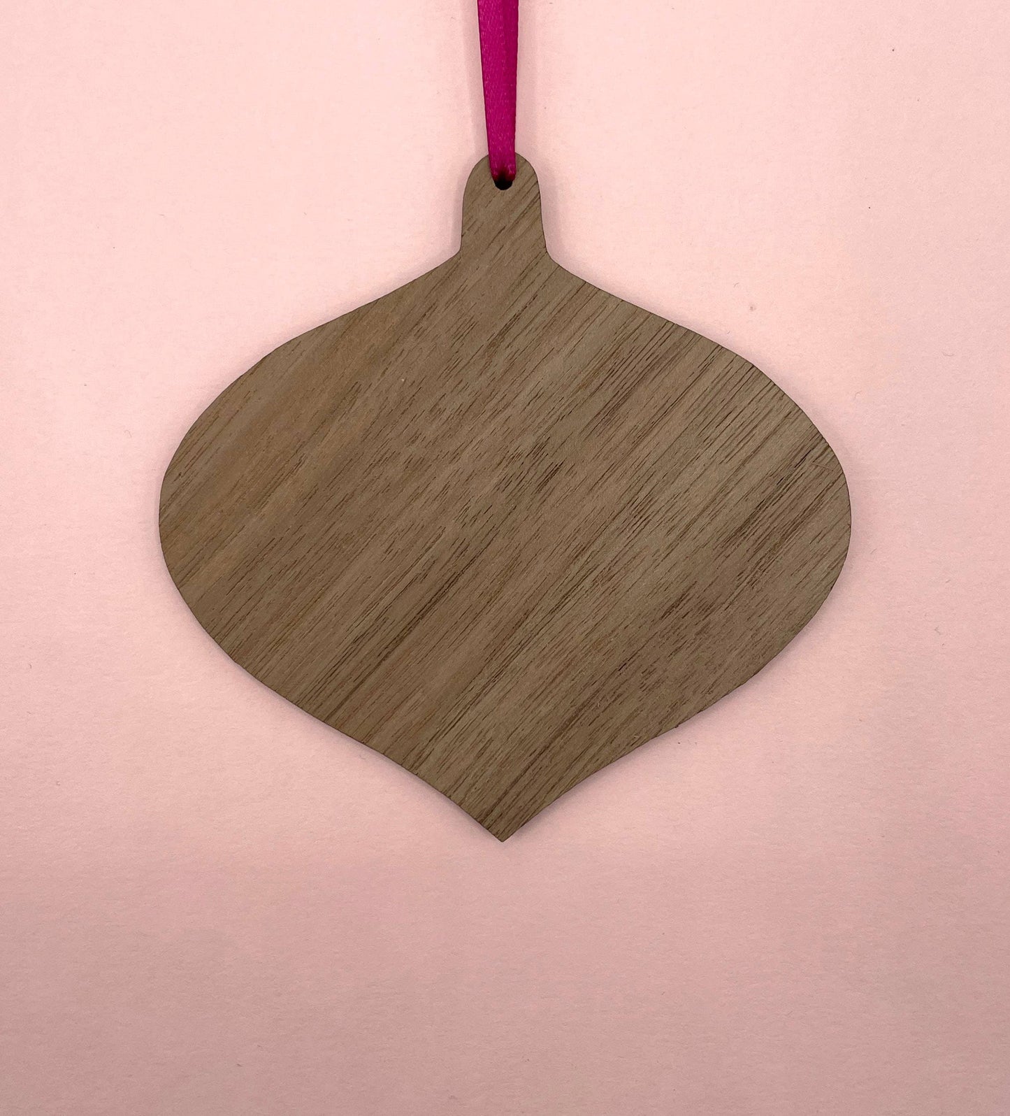 Eco-friendly Pink Strongman wood ornament by Su Owen, glossy finish, ready to hang