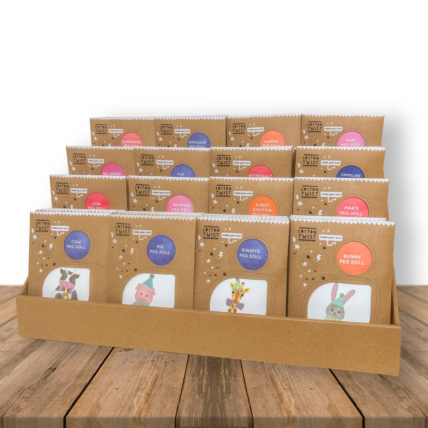 Assortment of Cotton Twist peg doll craft kits for children, including the astronaut