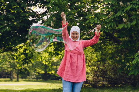 Close-up of Dr Zigs 10x Concentrate Bubble Mix 100ml bottle, creating over 1 litre of non-toxic bubble solution.