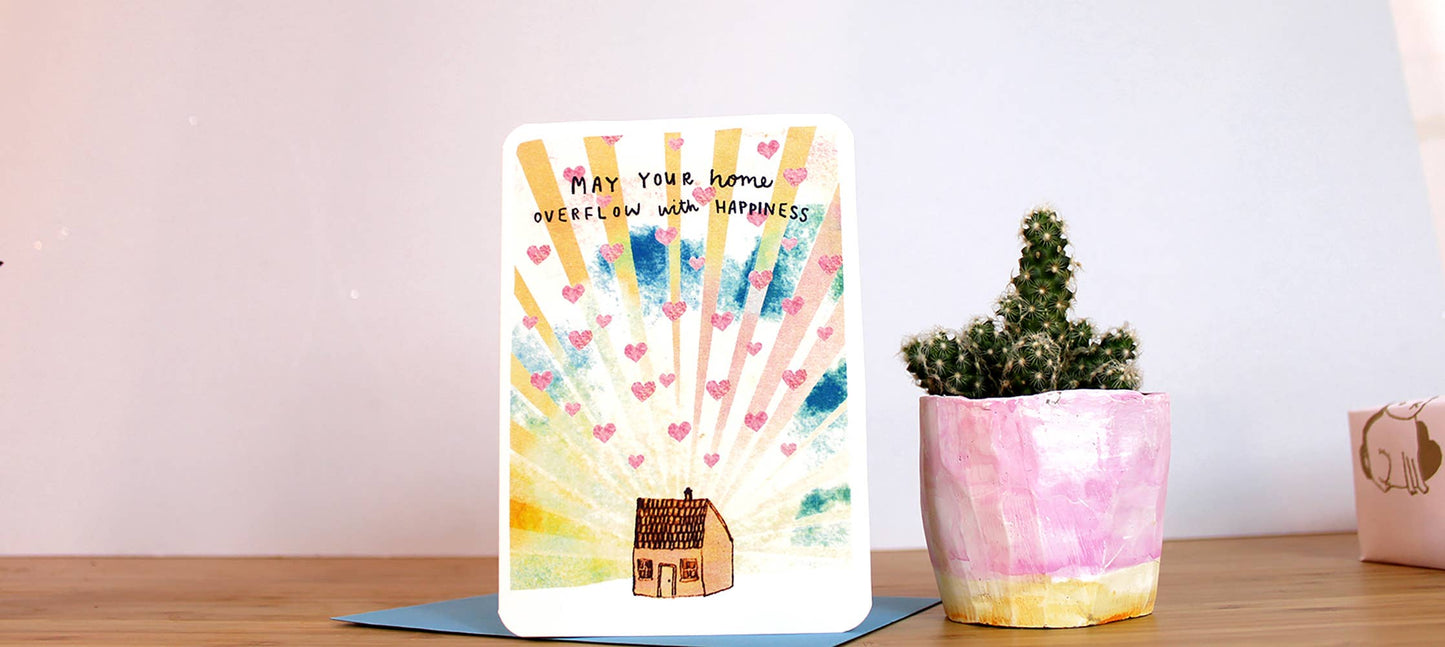 Eco-friendly housewarming card by Laura Skilbeck, 'May Your Home Overflow with Happiness' design, made from 100% recycled card with biodegradable packaging, British made.