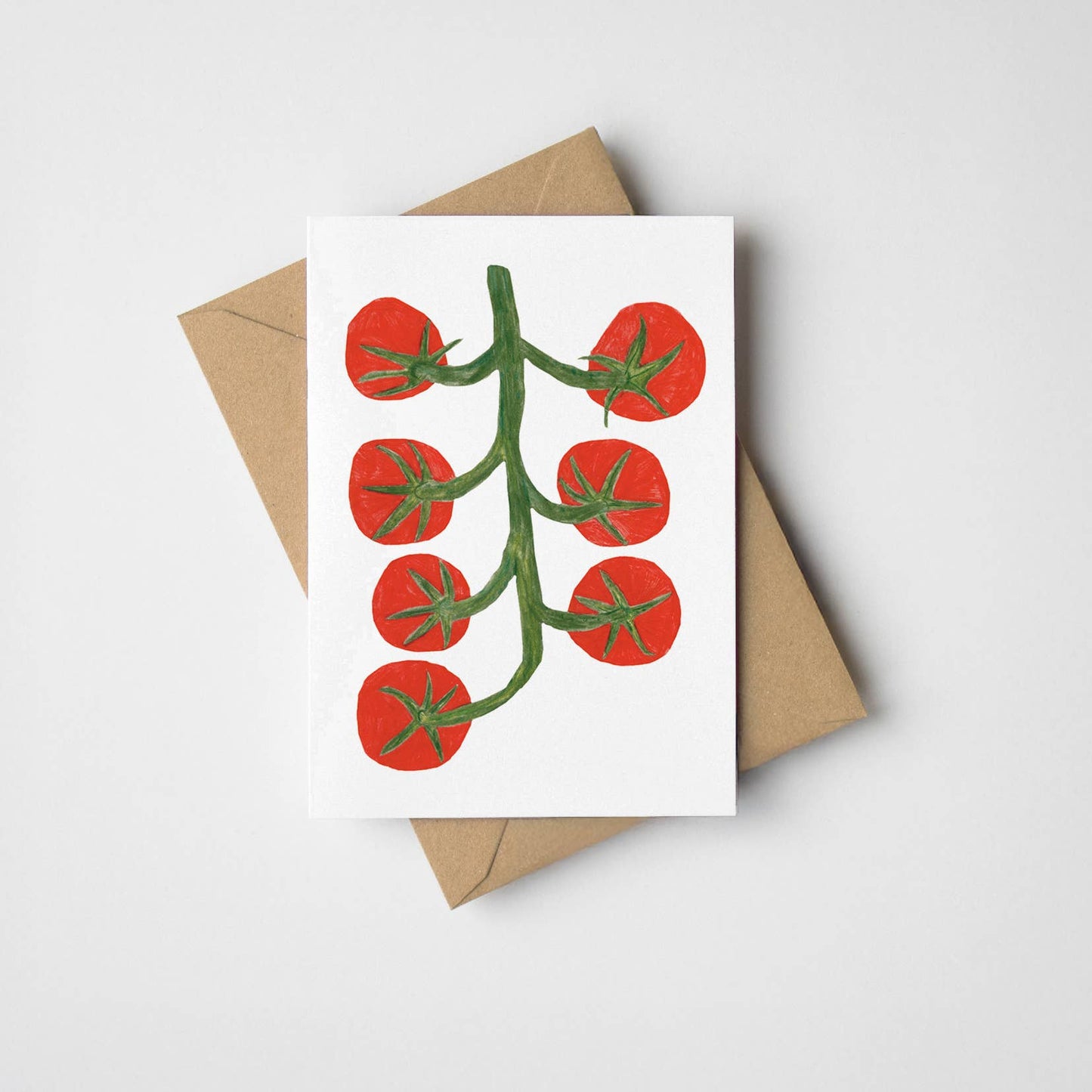 A mini card featuring an illustration of tomatoes on a vine. A7. Comes with a kraft envelope. Printed in the UK.