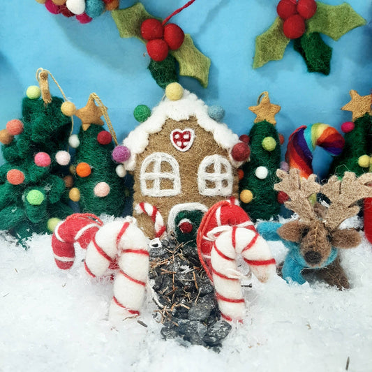 Close-up of handmade felt sweetshop house, intricate details, sustainable Christmas decor