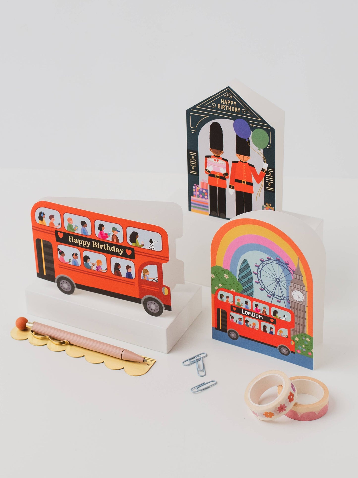 Three colorful greeting cards with London-themed designs on a white background.
