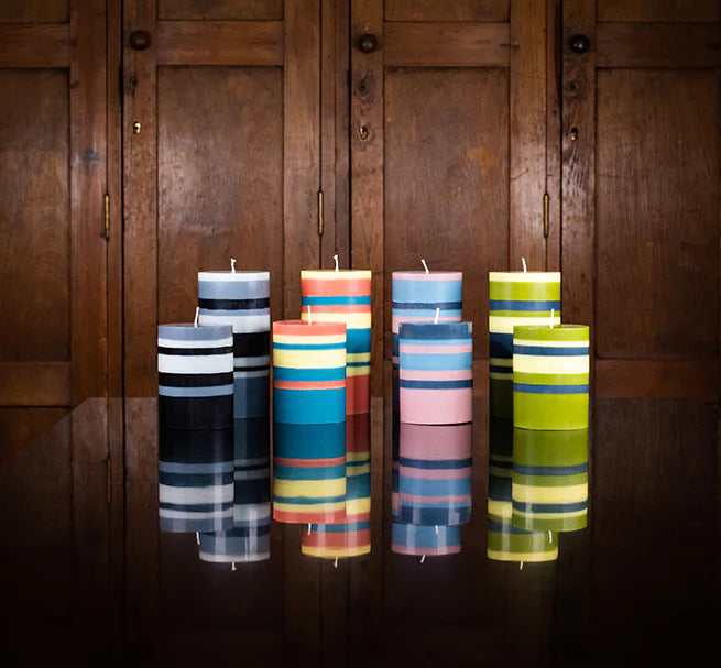 Collection of British Colour Standard striped pillar candles in various sizes and vibrant colours.