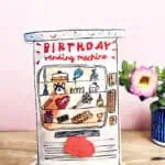 Recycled plastic-free birthday vending machine card packaged in biodegradable sleeve