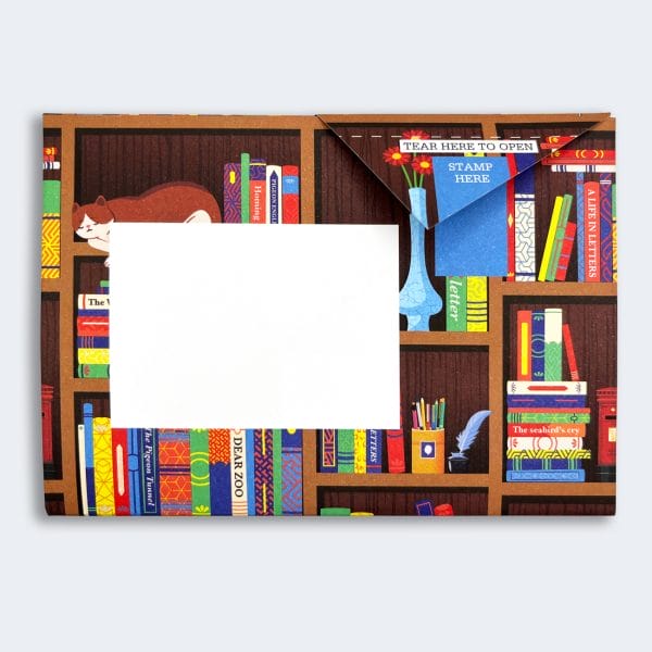 Bookstore Pigeon letter set, inspired by origami, featuring brown bookshelves filled with colourful books, a white teapot, and a charming pigeon illustration. A unique letter and envelope combination for thoughtful communication.