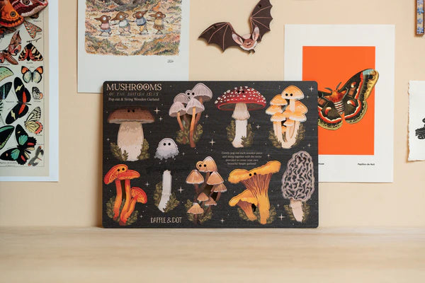 Hand designed Mushrooms of the British Isles garland, perfect for decorating your home or workspace. Perfect for nature lovers or toadstool enthusiasts. Made from sustainably sourced maple wood.
Made in Dapple & Dot's New Forest studio, from the illustration, to the laser cutting, to the printing to the packing.
EACH PRODUCT INCLUDES: 1 x pop out wooden sheet, 2 metres of cotton twine, 1 x labelled kraft envelope as packaging.