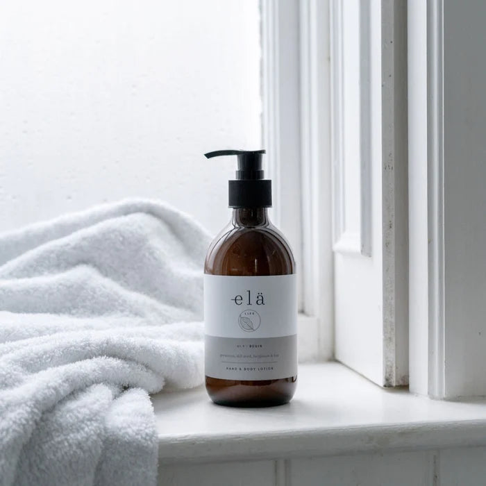 Close-up of Begin No 1 Hand & Body Lotion bottle, featuring natural Coconut & Grapeseed for daily hydration