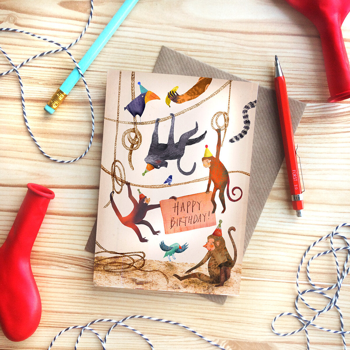 Happy Birthday Monkeys greeting card by Emily Nash with recycled kraft envelope, sustainably certified card