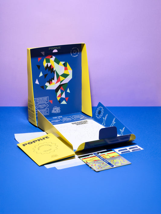 Close-up of Dinosaur POPKIT transfer with roaring T-Rex head, perfect for upcycling clothes.