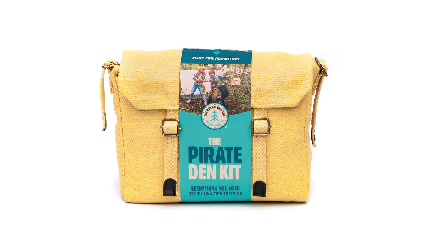 Pirate Den Kit including yellow cotton haversack, cotton calico tarpaulin, waterproof groundsheet, handmade wooden mallet, jute rope, steel tent pegs, pirate eye patch, and Jolly Roger bunting.