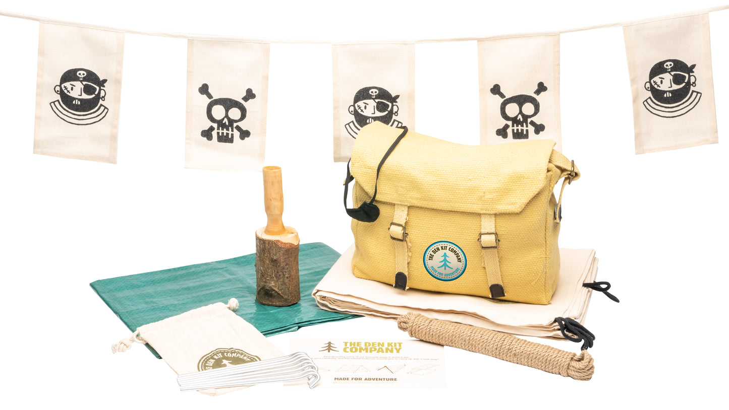 Pirate Den Kit including yellow cotton haversack, cotton calico tarpaulin, waterproof groundsheet, handmade wooden mallet, jute rope, steel tent pegs, pirate eye patch, and Jolly Roger bunting.