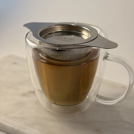 Eco-friendly tea strainer resting on a mug