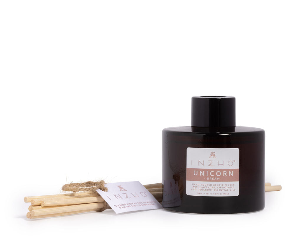 Close-up of Unicorn Sleep Reed Diffuser in a compostable cylinder box, showcasing essential oil ingredients.