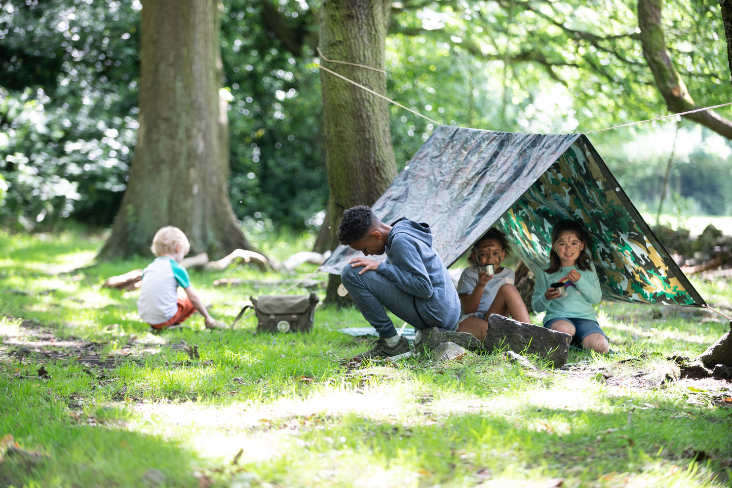Children at play inside and outside of their Den.