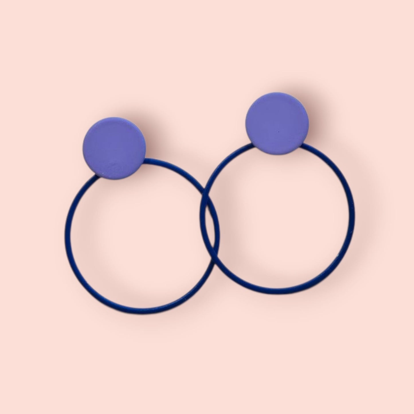 Minimalist colourful powder-coated brass circle and dot stud earrings by Copper Bee. Lightweight hypoallergenic stainless steel posts. Handmade UK jewellery.