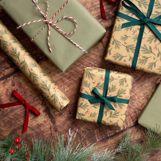 Festive Branches & Bows Christmas Gift Wrap, 5m roll, 500mm wide, 100% recycled brown kraft, eco-friendly sustainable wrapping paper.