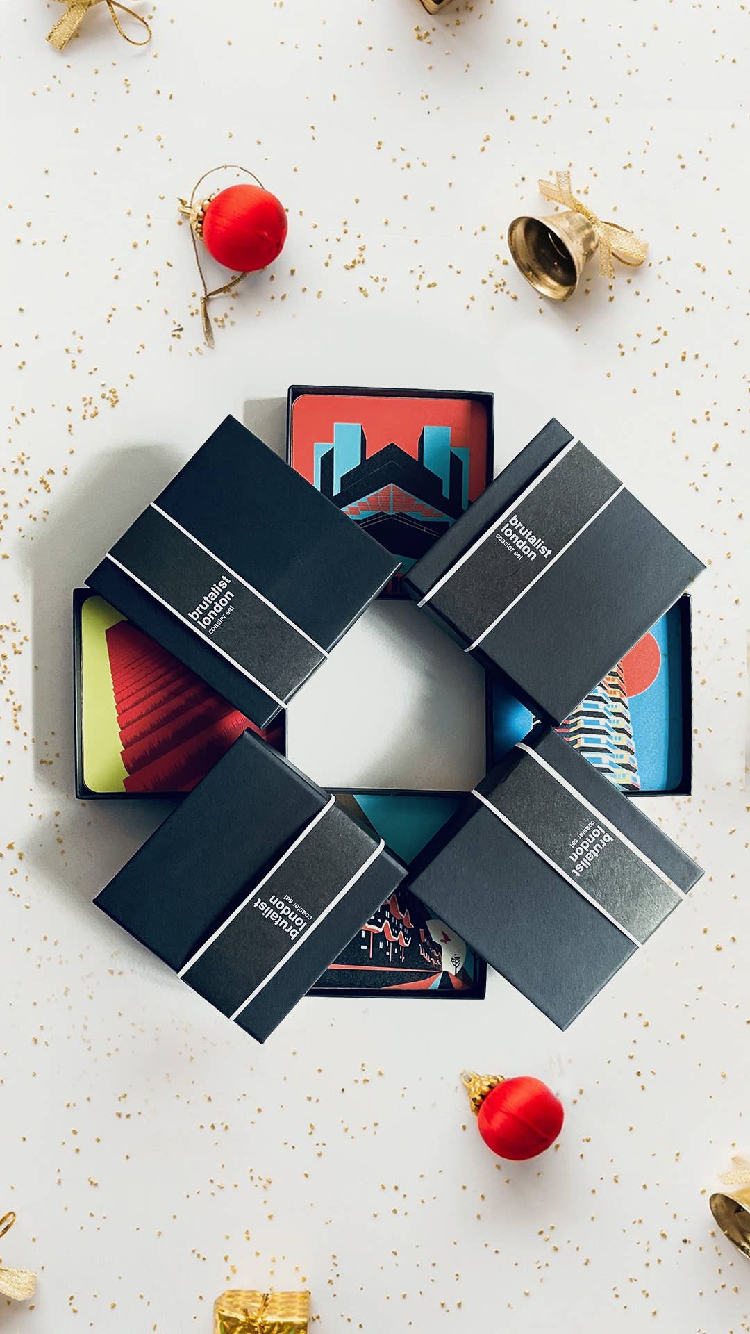 Brutalist London Coaster Set. Brutalist London Coaster Set. Set of 4 coasters featuring London Landmarks. Prints of Barbican, Brixton, Croydon and National Theatre. These coasters feature some of the most iconic Brutalist structures of London. One Croydon, the Barbican Tower, Southwyck House, Brixton and the National Theatre in South Bank.
Specs: The coasters measure 10 x 10cm, about 5mm thick. Cork backed hardboard, and matte laminated finish.
They come in a smart, minimal black match-box style packaging