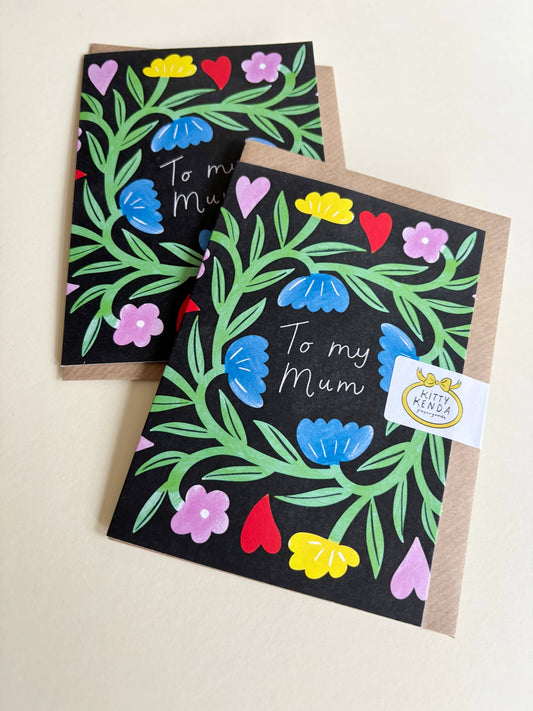 Close-up of 'To My Mum' greeting card with colourful floral design and kraft envelope