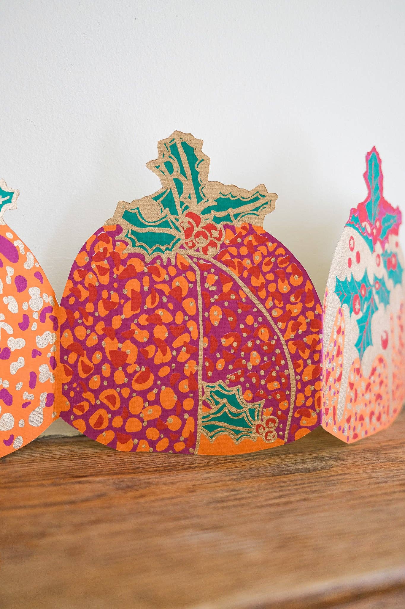 Hand-printed recycled paper Christmas Puddings Concertina Garland by East End Press, 3 metres long