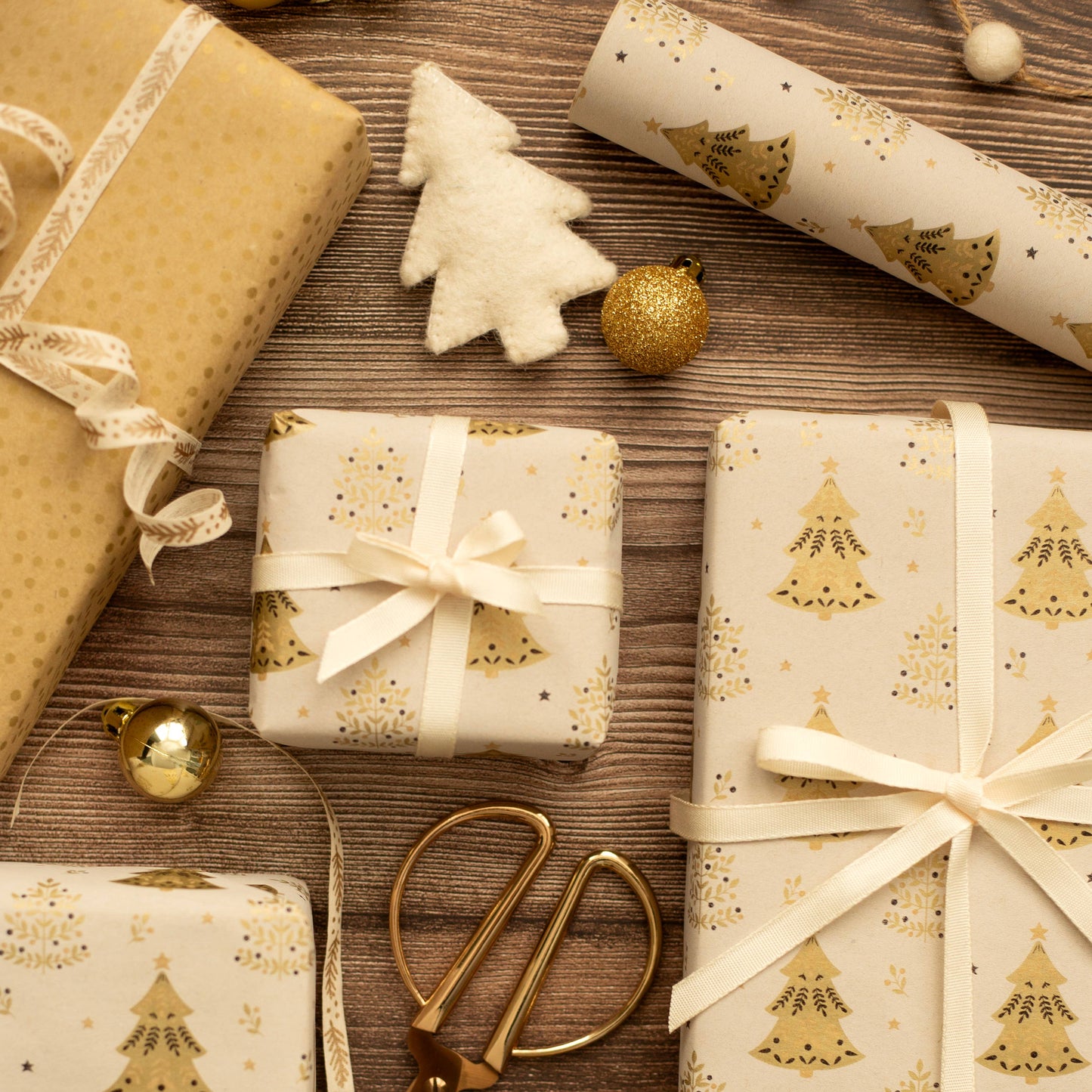 Gold Christmas Trees Festive Gift Wrap, 5m roll, 500mm wide, brown kraft with gold tree design, sustainable eco-friendly Christmas wrapping paper.