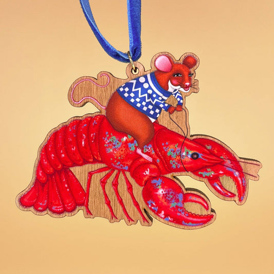 Mouse On A Lobster wooden Christmas tree decoration with Teddy & Kipling illustration, sustainably certified cherry wood, gold-plated ring, and royal blue velvet ribbon.