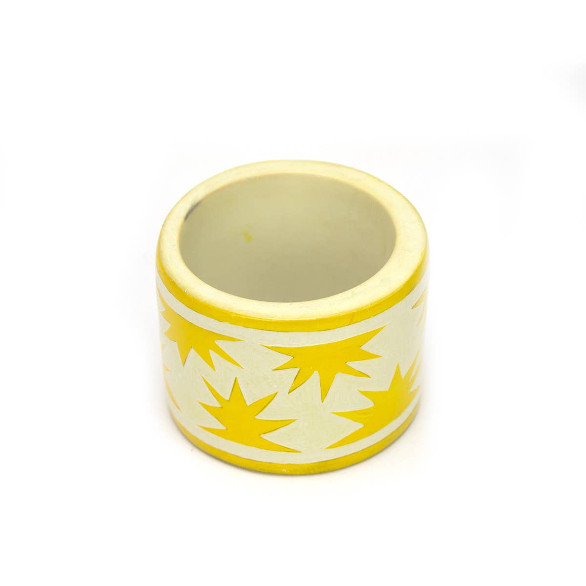 Hand carved yellow sun soapstone napkin ring, crafted in Kisii, Kenya with natural colour variation, African artisan-made dining accessory.